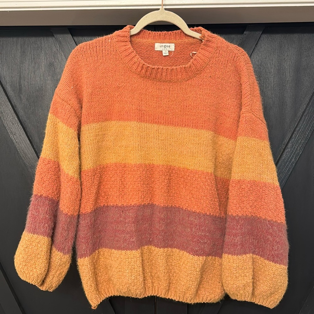 Orange striped sweater. Size large.
